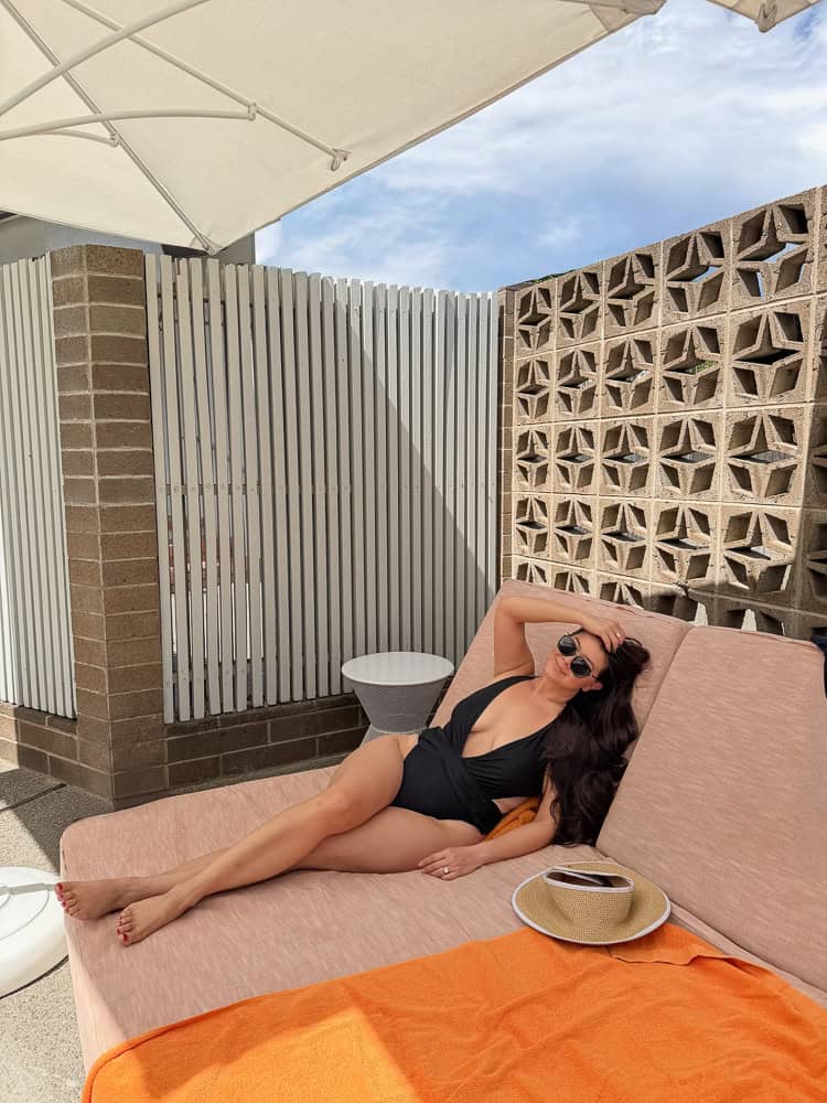 Lounging on a poolside daybed at Dr. Wilkinson's mineral pools in Calistoga
